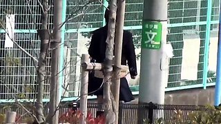 Asian students urinating outdoors