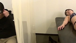 A married woman gets a massage while her husband is next to her. 2