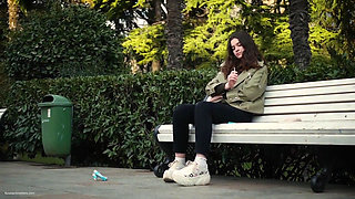 Young Brunette Is Taking an Unhurried Stroll with Allwhite 120mm Cigarette