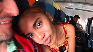 Thai teen on an airplane and on a cock