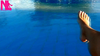 Barefoot Dangling in Swimming Pool Water