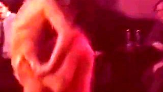 Blonde Stripper Bends Showing Shaved Pussy