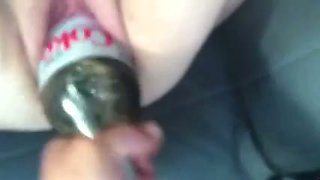 Shoving a plastic bottle in her big loose pink cunt