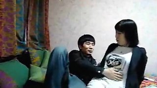 Chinese couple bedroom blowjob