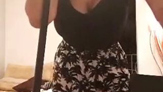Busty latina sweeps up tight top