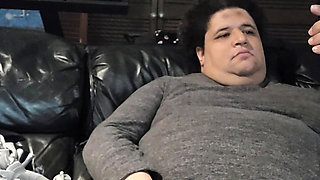 Bored fat trans playing on couch
