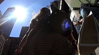Desirable blonde with a heavenly ass upskirt on the street