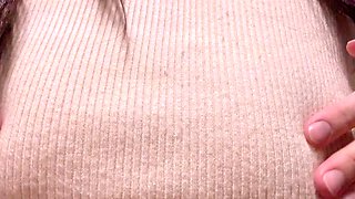 Sensuous brunette with big tits plays with her nipples