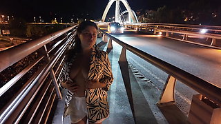Luscious Milf walks without Bra and Panties on the Bridge