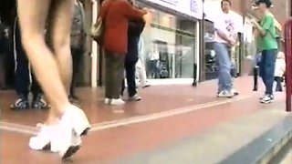 Peeping on a leggy redhead in public