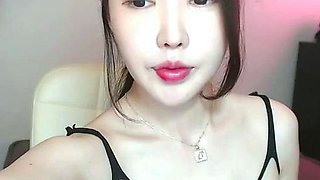 Busty Korean teen camgirl in pantyhose masturbates