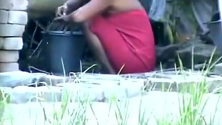 wow... outstanding desi village gal bathing outside