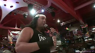 blonde babe fights a guy in a wrestling match