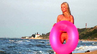 Hot naked blonde on the beach