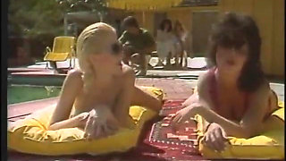 Hot babes enjoy as they give a huge pole a blowie outdoors then get fucked