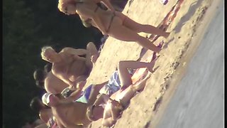 Naked tourists caught on beach spy cam relaxing and enjoying nudity