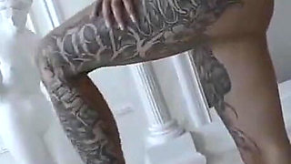 Plumpy tattooed MILF is dancing striptease