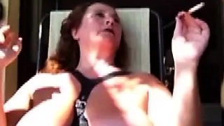 Big tit brunette amateur fucks a dildo close up