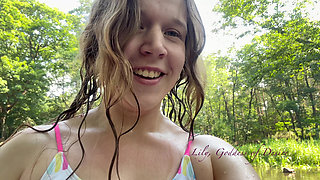 Cute Teen in Costume Playing in the River Like in a Swimming Pool