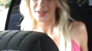 An attractive blonde on the car wash practices sex for