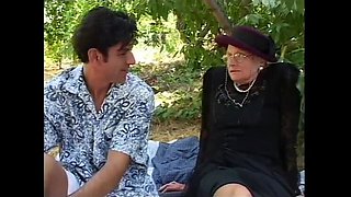 Sex-crazed granny takes a hard pounding from behind outside