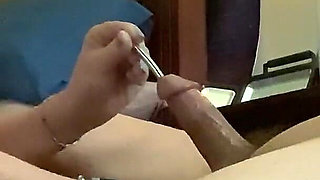 Wife Pleasures Her Man’s Cock with Sounding Rod