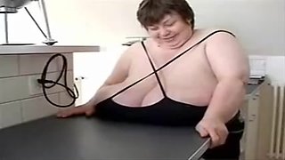 Mature with huge tits lets a younger boy have fun