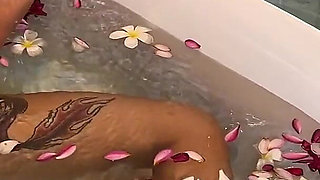 Bath of Blossoms Naked MILF Masturbates Among Flowers