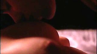 Shannon Tweed bent over a pool table as a guy has sex with